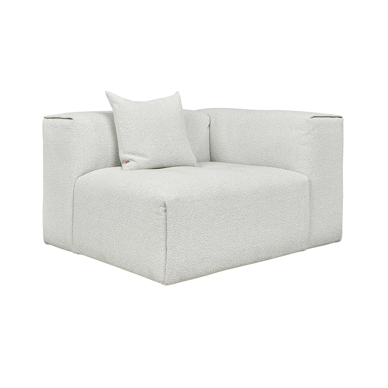 Textured white bouclé armchair with minimalist design and plush cushion