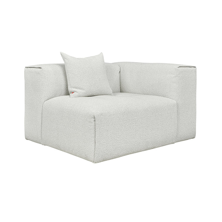 Textured white bouclé armchair with minimalist design and plush cushion