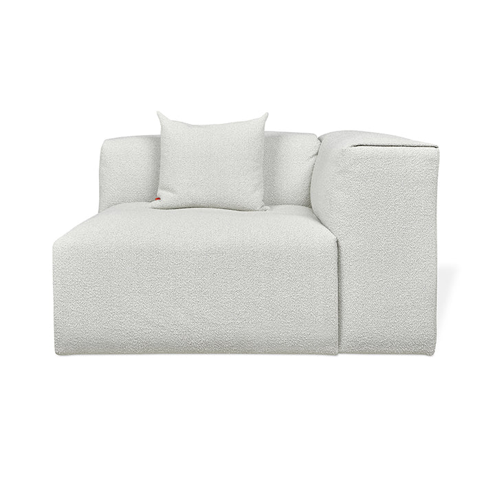 Textured white modular sofa with plush cushion, minimalist design