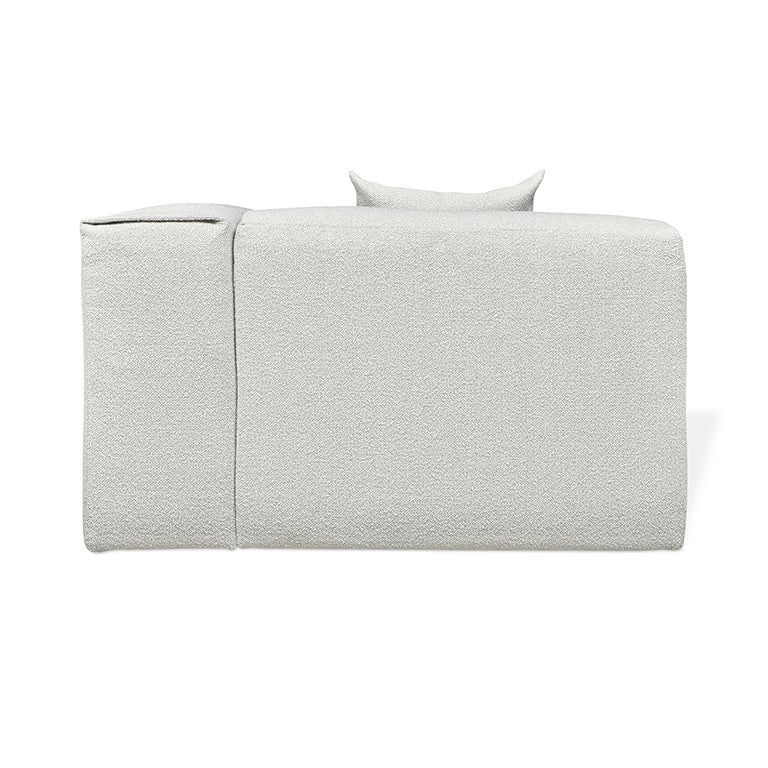 Textured white upholstered sofa with minimalist design and plush cushions