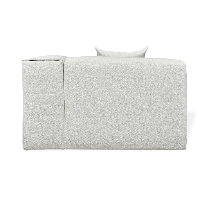 Textured white upholstered sofa with minimalist design and plush cushions