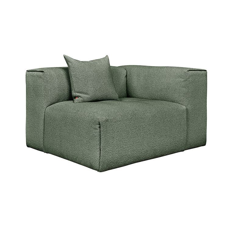Sleek sage green modular sofa with textured fabric and designer cushion