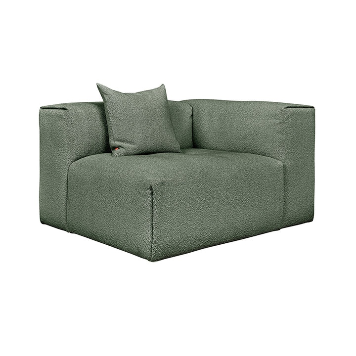 Sleek sage green modular sofa with textured fabric and designer cushion