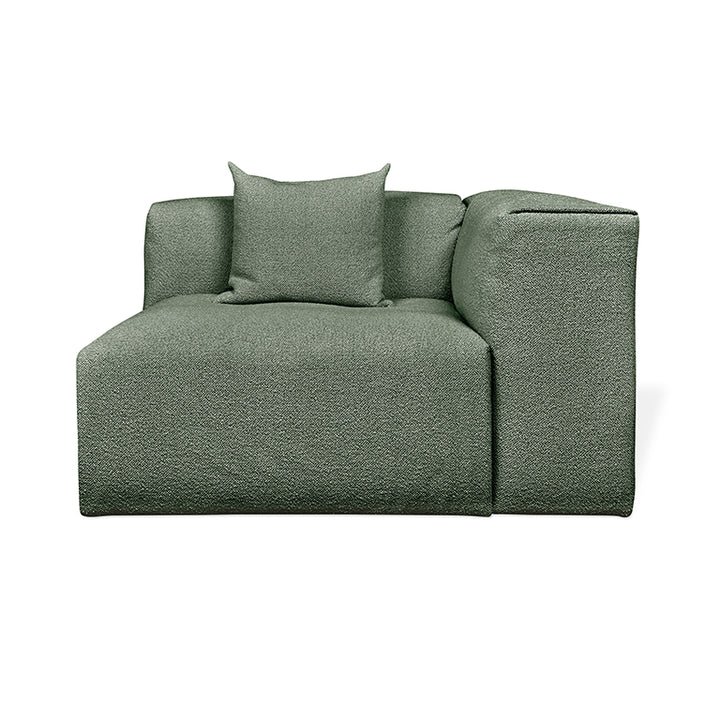 Sleek sage green modular sofa with textured fabric and plush cushion