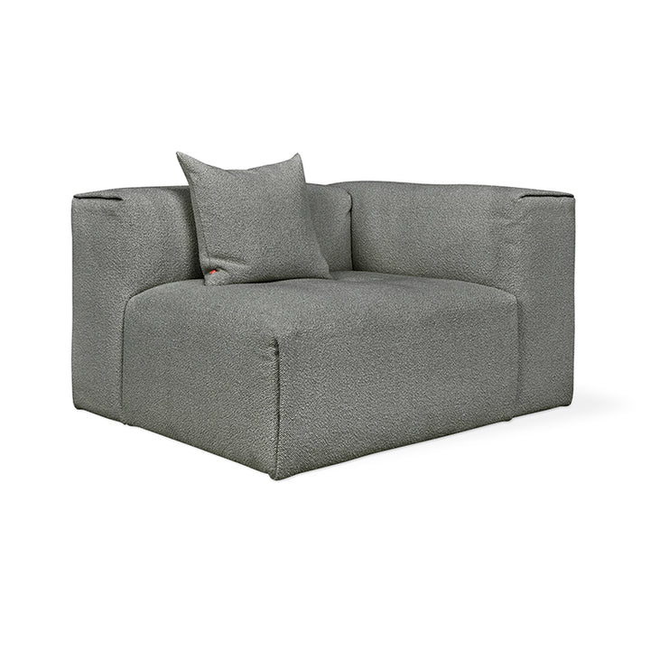 Modern gray bouclé armchair with plush cushion, minimalist design for contemporary living spaces