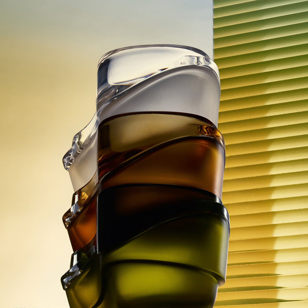 Plex Vessel, Set of 2 — clear, amber and Olive Green vessels stacked tall against a sunlit slatted blind