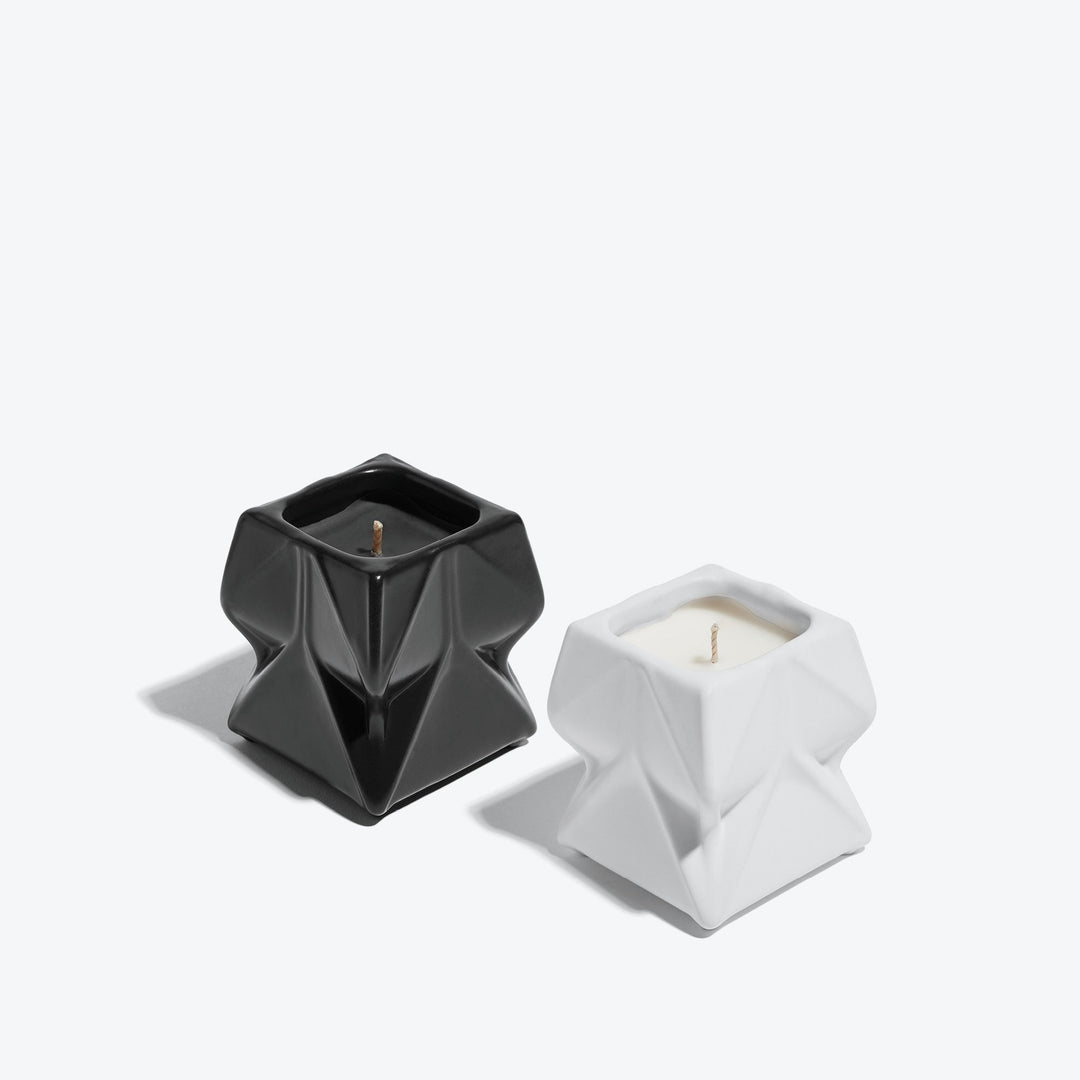 Prime Scented Candle Duo, Set of 2 — black and white faceted porcelain candles, three-quarter view on a white background