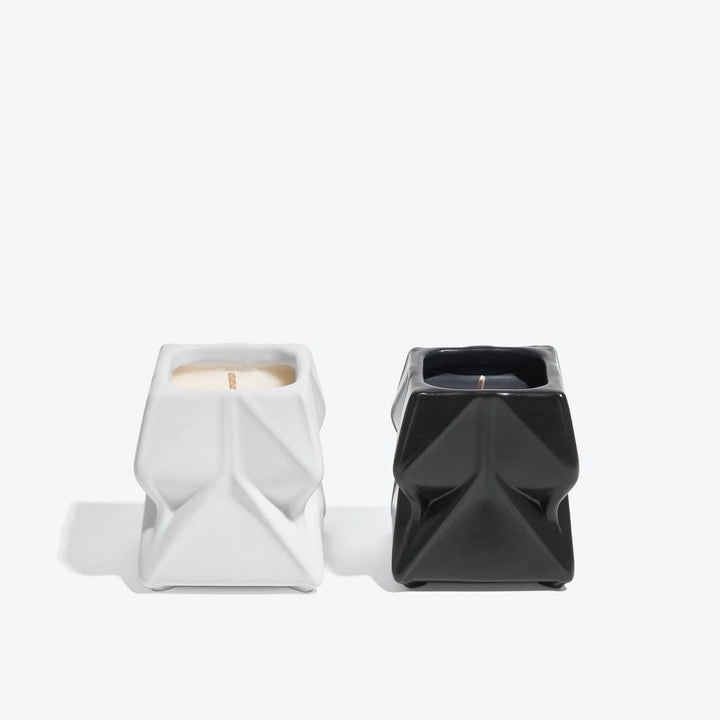 Prime Scented Candle Duo, Set of 2 — white and black faceted candles side by side, front view