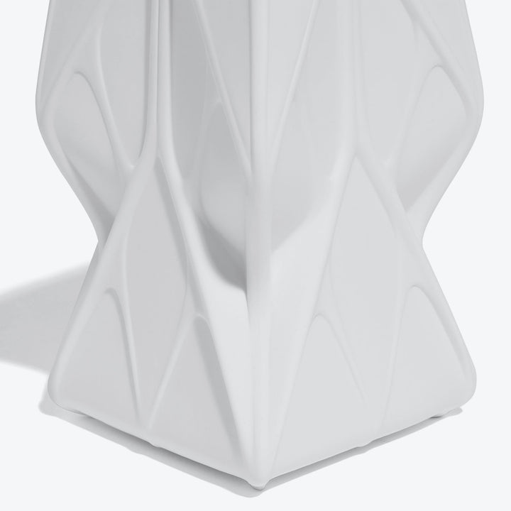 Prime Scented Candle — Tall white candle, close-up of the matte faceted ceramic