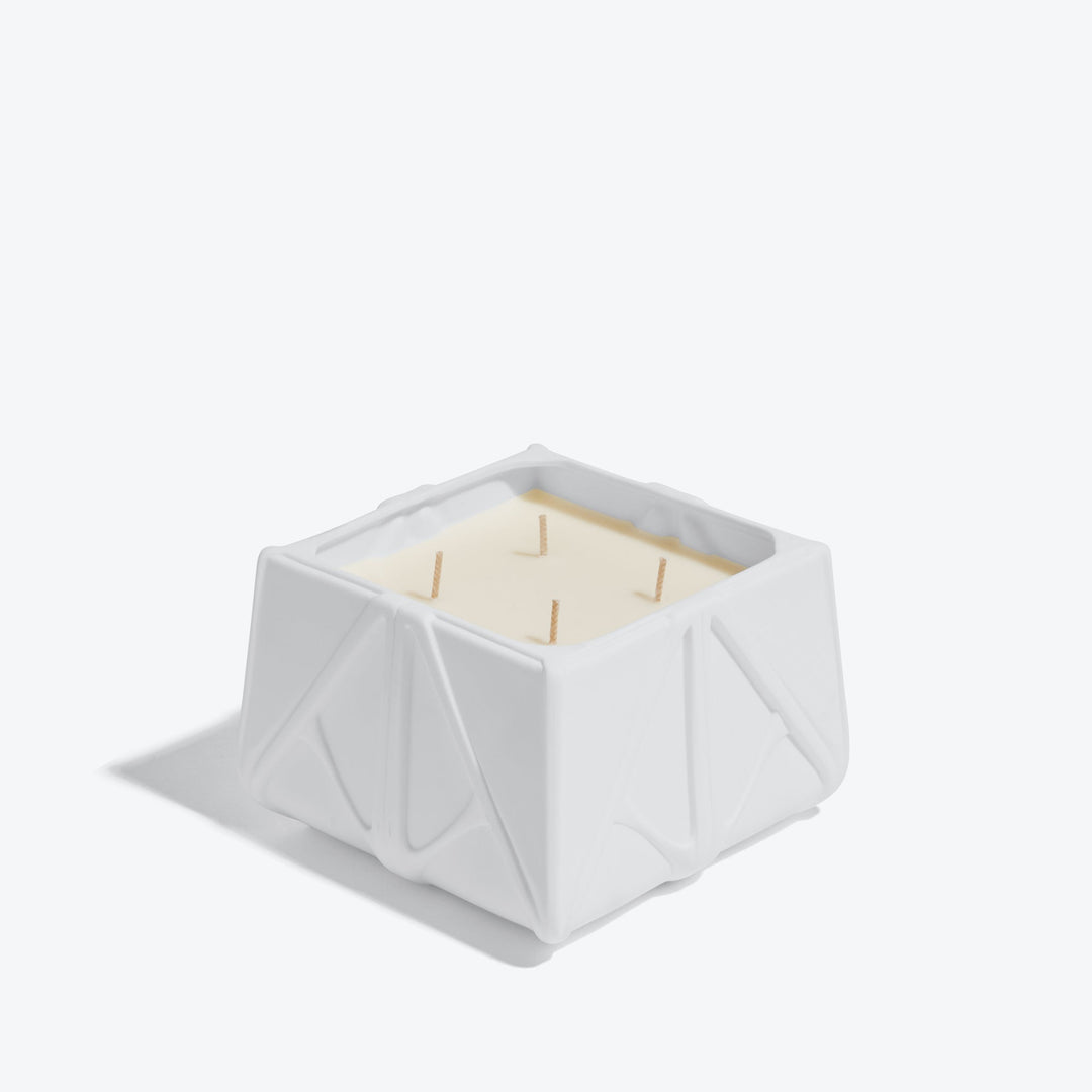 Prime Scented Candle — Large white four-wick candle, three-quarter view on white