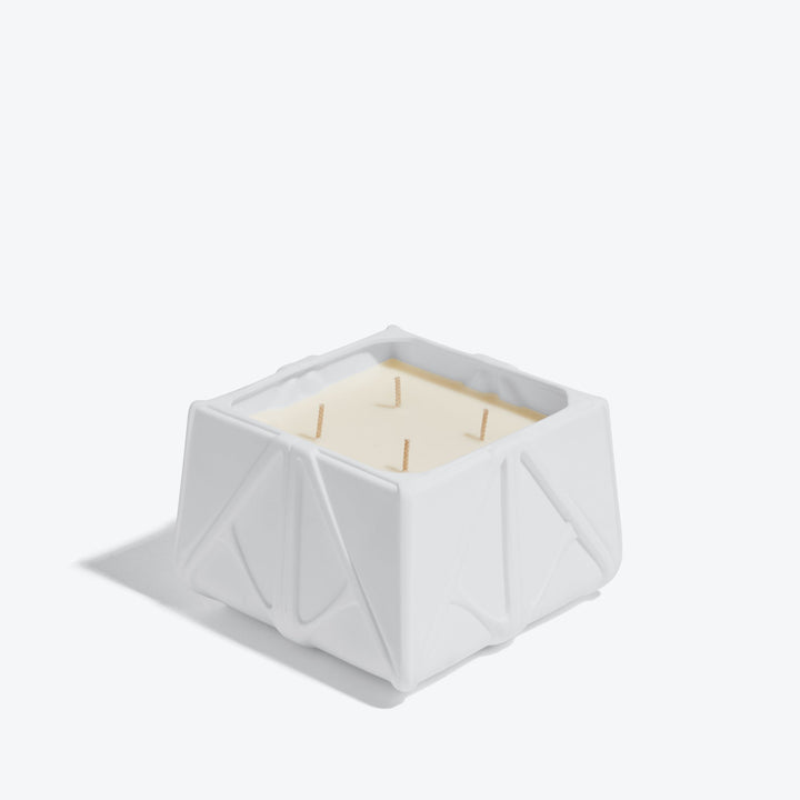 Prime Scented Candle — Large white four-wick candle, three-quarter view on white