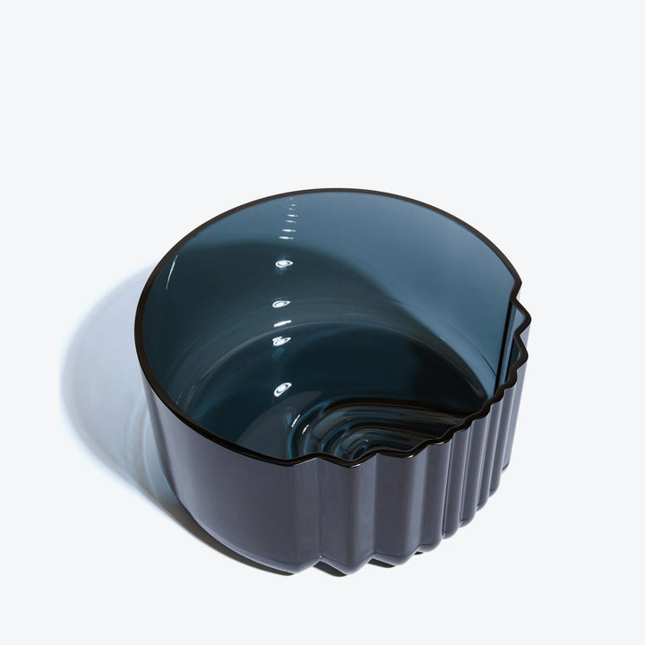 Pulse Bowl — Dark Blue glass bowl, three-quarter view from above into the stepped interior