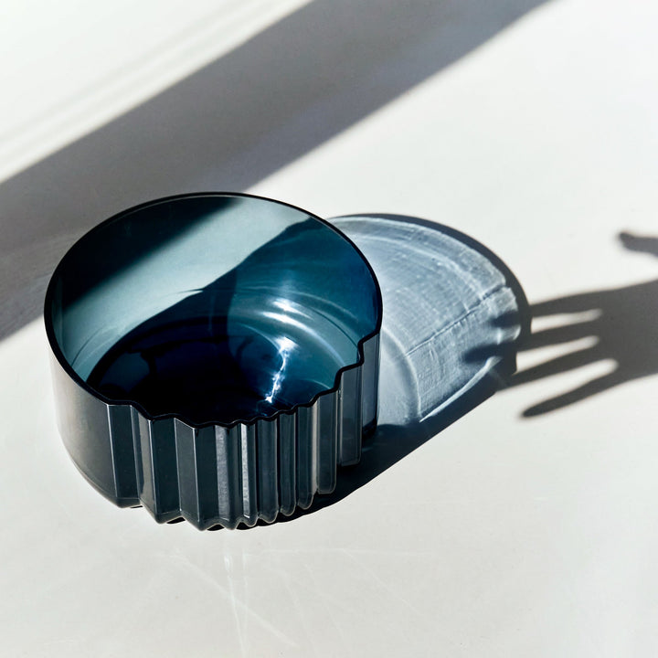 Pulse Bowl — Dark Blue glass bowl from above in bright sunlight with crisp shadows