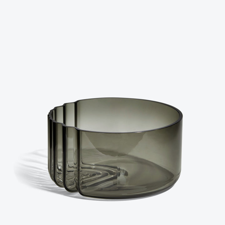 Pulse Bowl — Smoke glass bowl, side view showing the ribbed wave edge on white