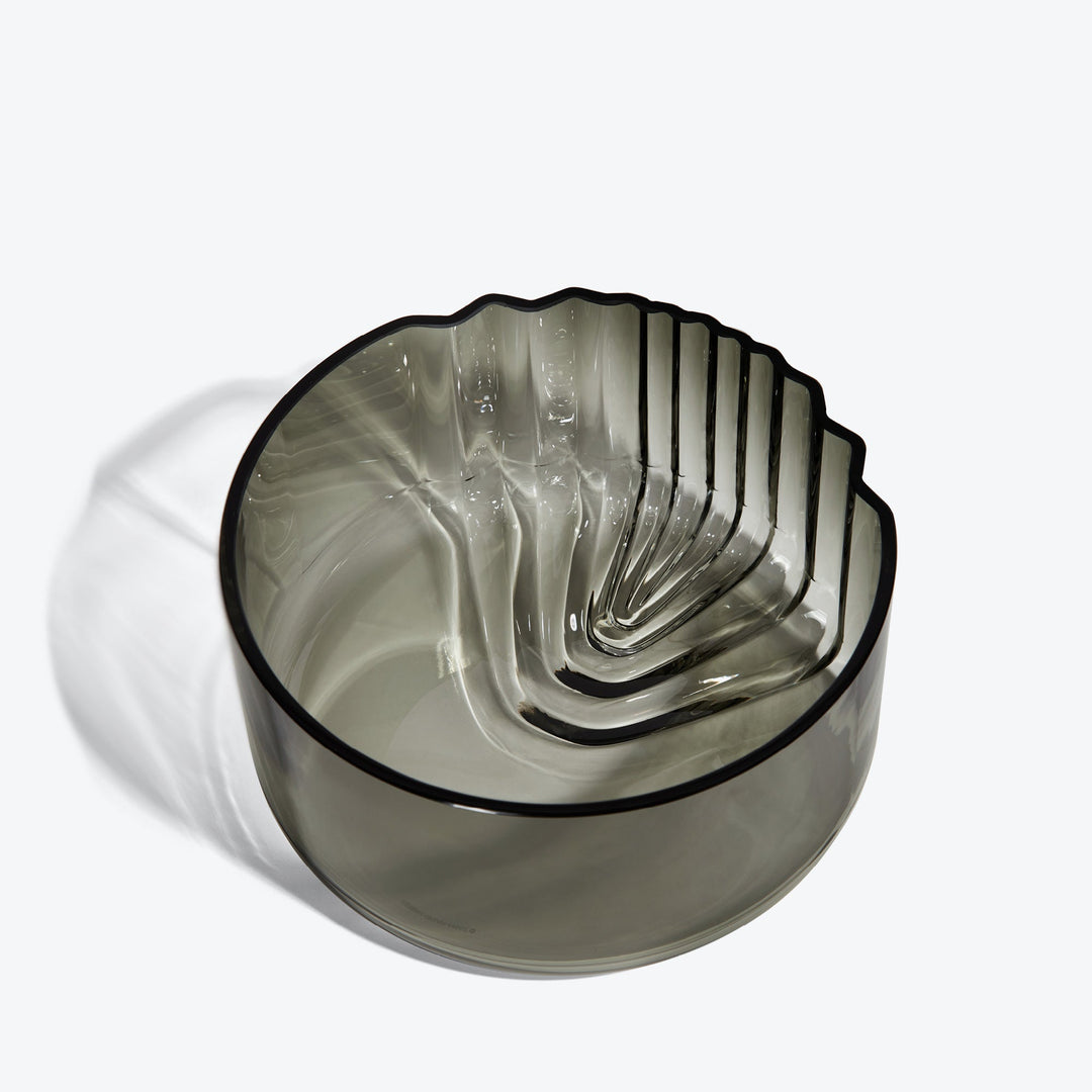 Pulse Bowl — Smoke glass bowl, three-quarter view from above into the stepped interior