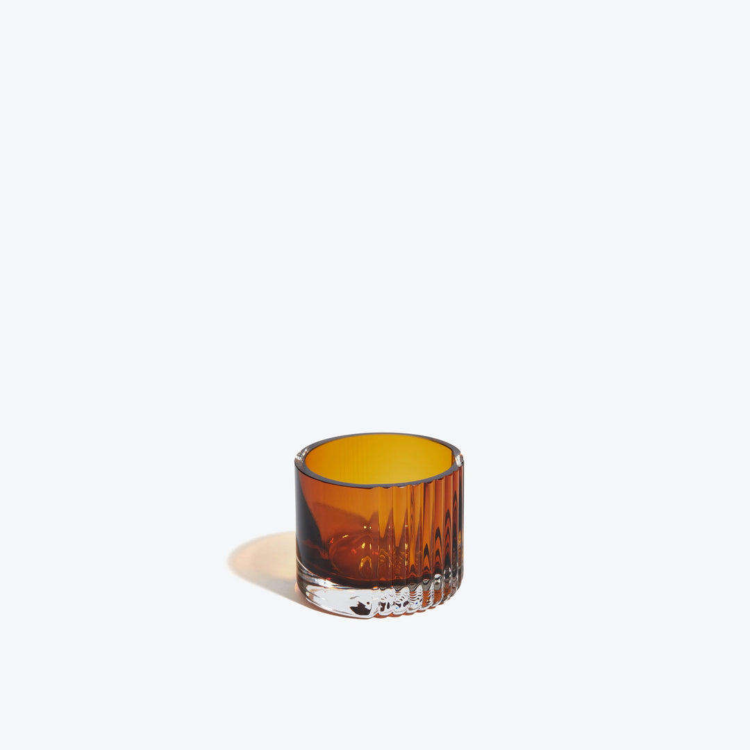 Pulse Tealight Holder X — amber ribbed glass tealight holder, front view on a white background