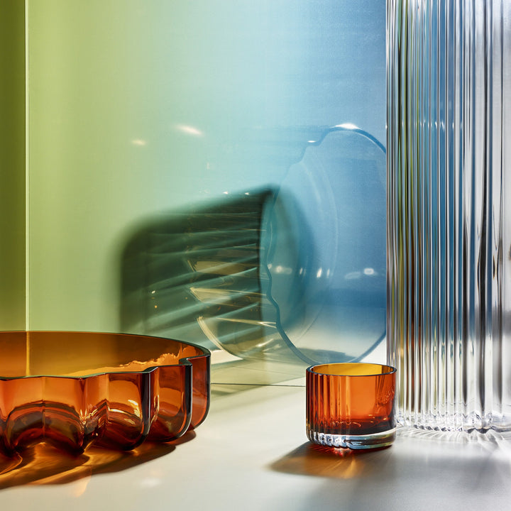 Pulse Tealight Holder X — amber ribbed glass tealight holder beside an amber bowl and fluted clear vase