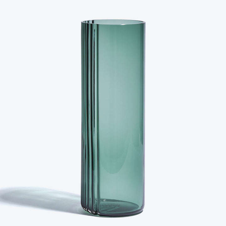 Pulse Vase — tall Grey Green glass vase, side view showing the ribbed edge on a white background