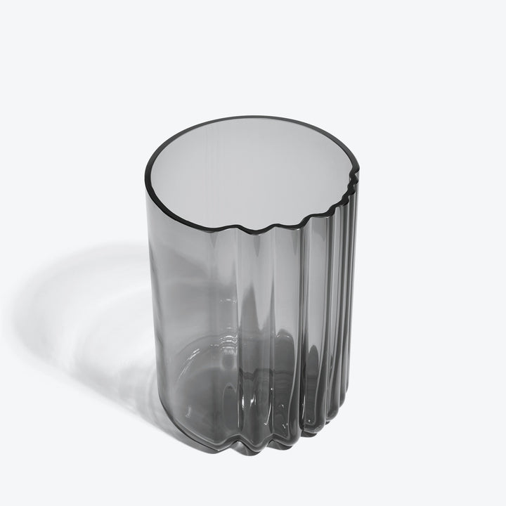 Pulse Vase — wide Smoke glass vase, high three-quarter view of the wavy rim on a white background