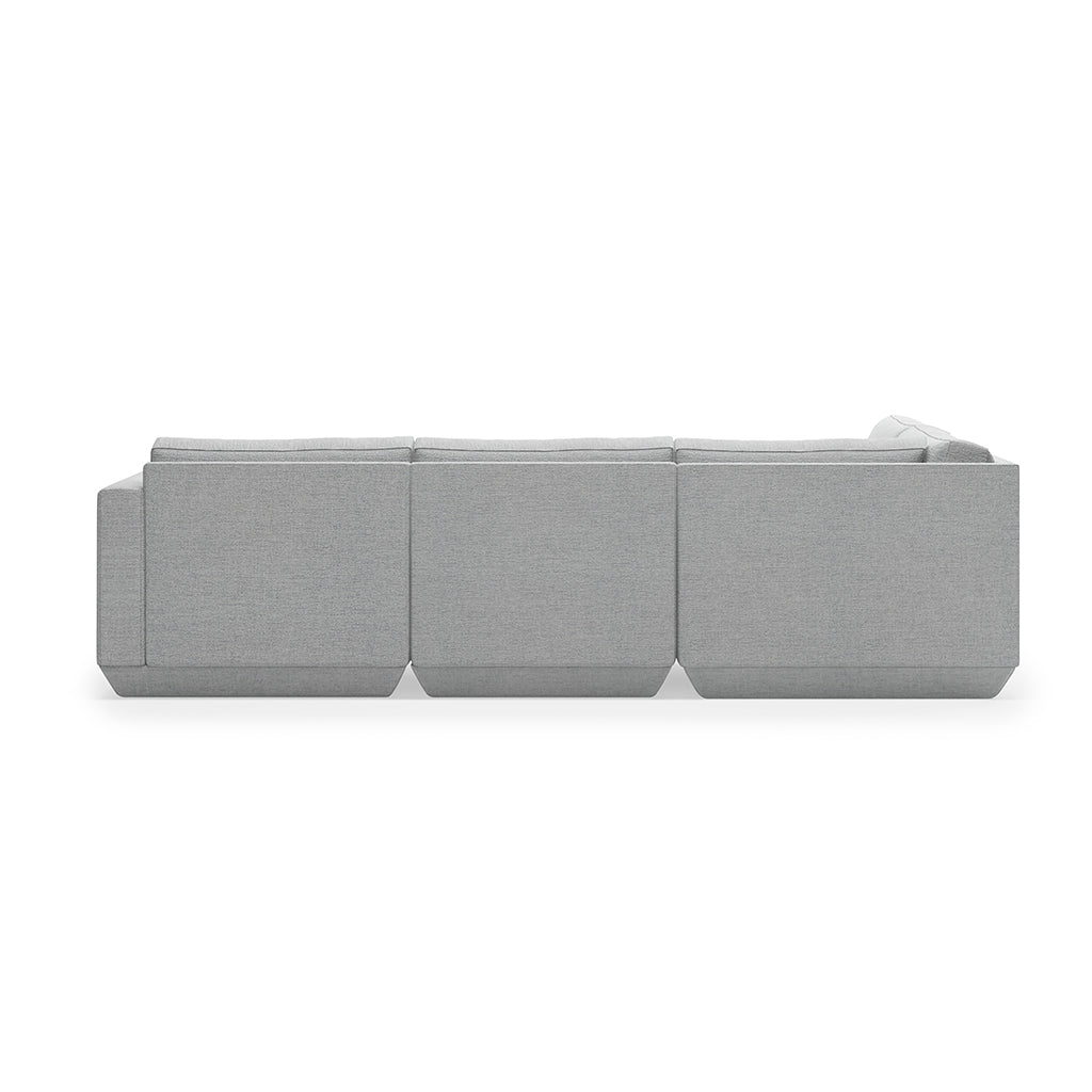 Modern gray modular sofa with clean lines and textured fabric