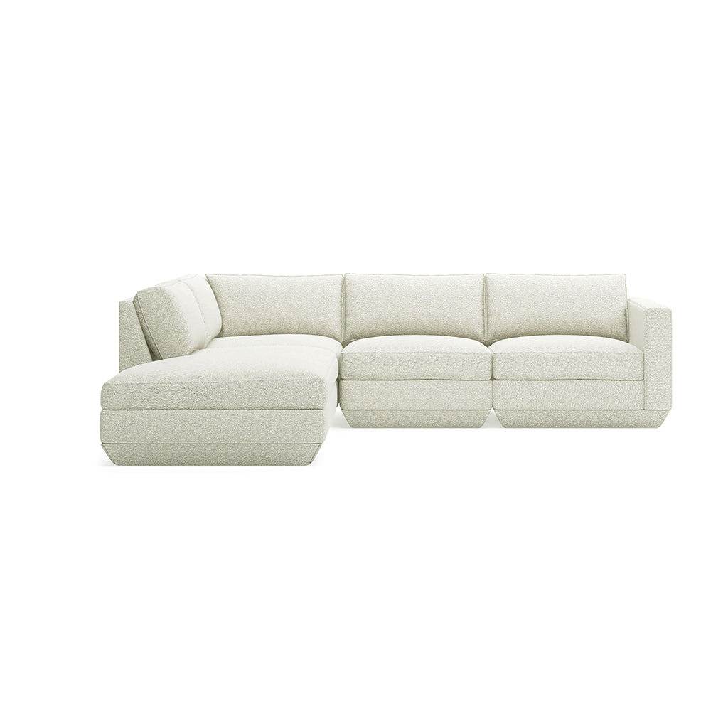 Elegant cream bouclé sectional sofa with modern design and plush cushions