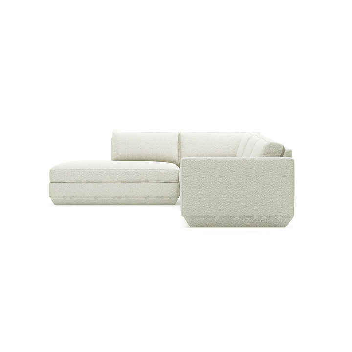 Elegant off-white sectional sofa with textured fabric, minimalist design for modern living spaces