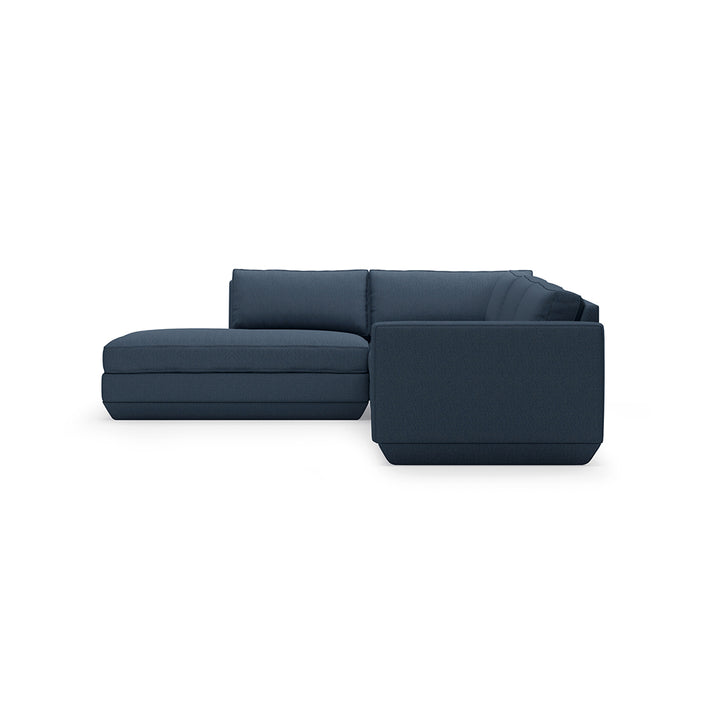 Navy blue modular sofa with clean lines and plush cushions, crafted for modern elegance.