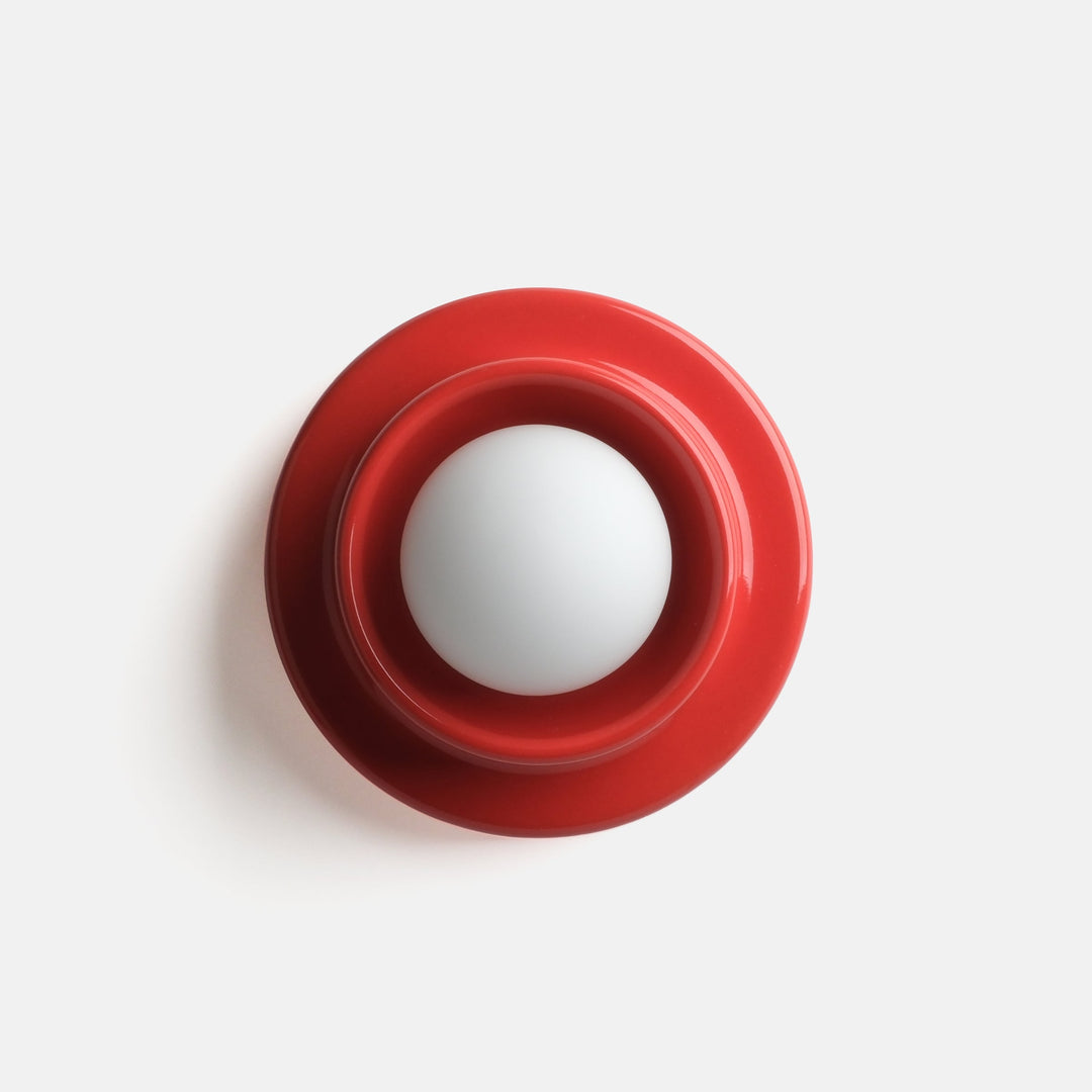 Vibrant red ceramic bowl with minimalist white center, modern designer home decor