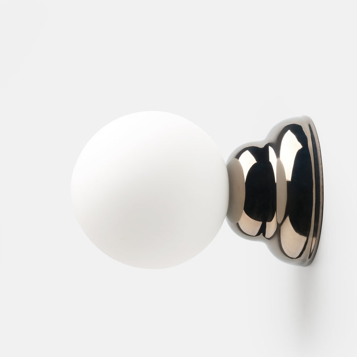 Matte white ceramic knob with polished chrome base, modern minimalist hardware design