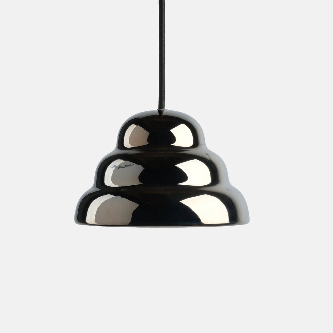 Glossy black ceramic pendant light with sculptural, tiered design and sleek black cord