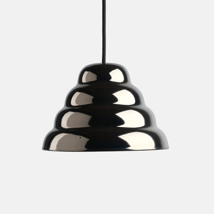 Glossy black ceramic pendant lamp with sculptural, tiered design and minimalist black cord.