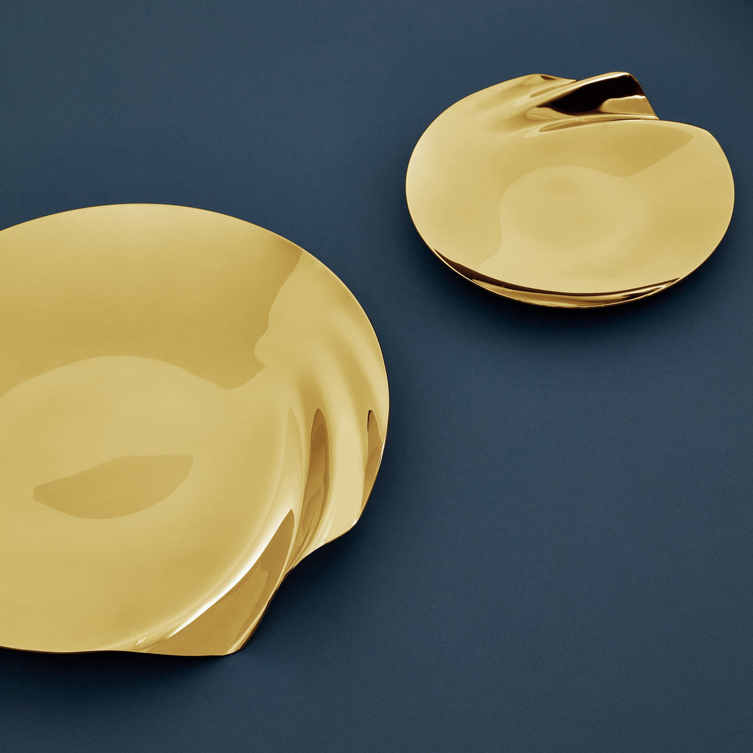 Serenity Platter — medium and large gold platters on a navy surface, top-down lifestyle view