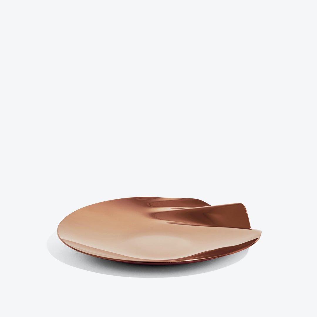 Serenity Platter — medium Rose Gold platter, low side view of the rippled edge on a white background