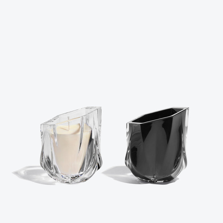 Shimmer Scented Candle Duo, Set of 2 — clear glass candle with ivory wax beside a black glass candle, side view on white