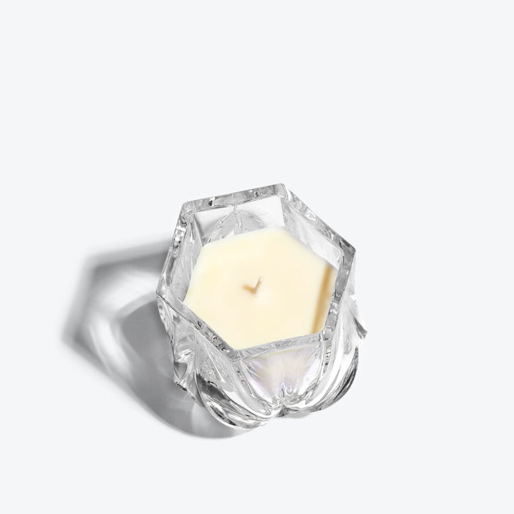 Shimmer Scented Candle — Clear crystal vessel, top-down view of hexagonal rim and wick