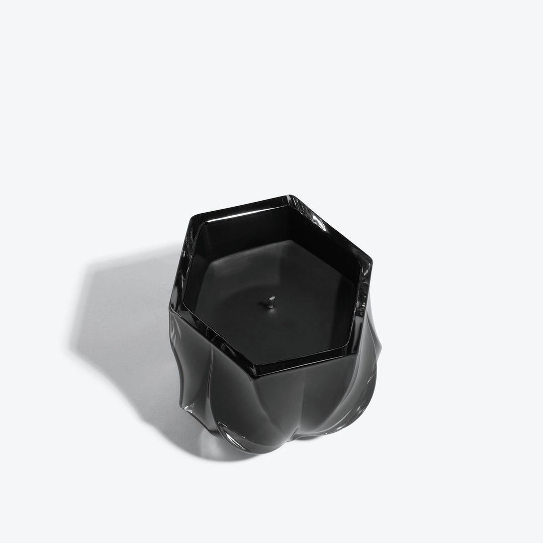 Shimmer Scented Candle — glossy black glass vessel, top-down view of hexagonal rim