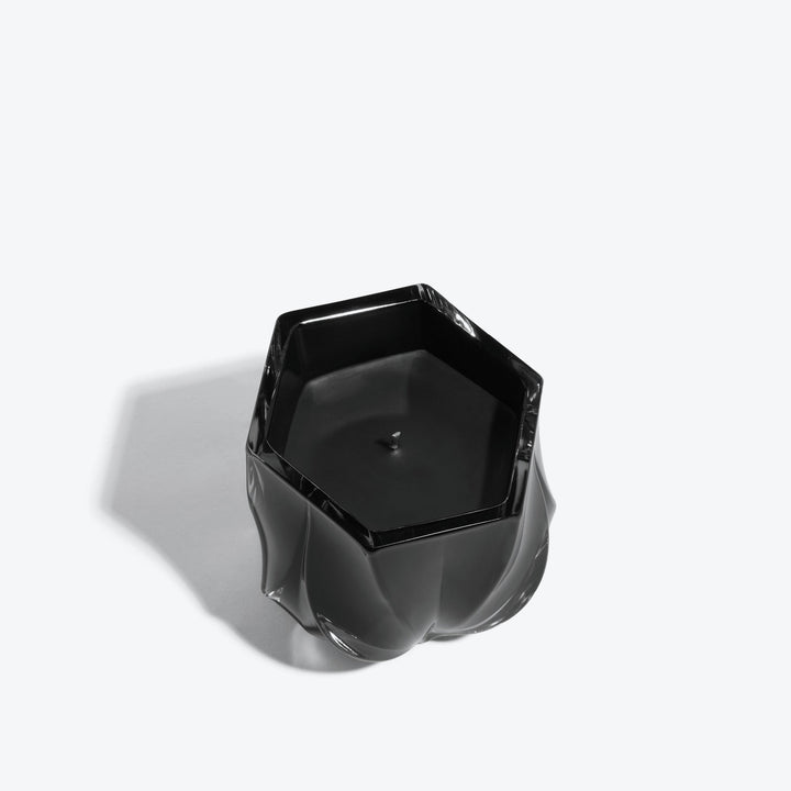Shimmer Scented Candle — glossy black glass vessel, top-down view of hexagonal rim