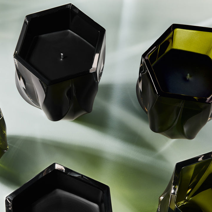 Shimmer Scented Candle — black and olive green candles from above on a pale green surface