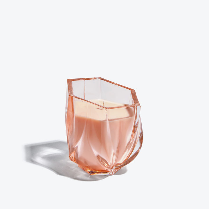 Shimmer Scented Candle — Rose tinted glass vessel with twisted facets, side view