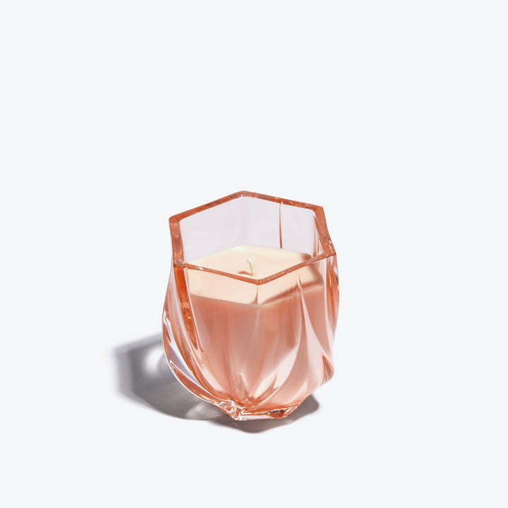 Shimmer Scented Candle — Rose tinted glass vessel showing faceted rim, front view
