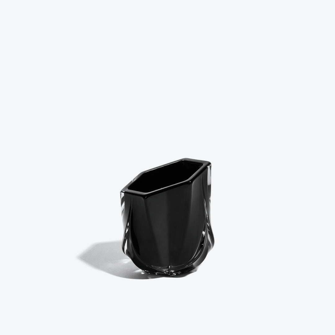 Shimmer Tealight Holder — Black faceted glass holder, three-quarter side view on white