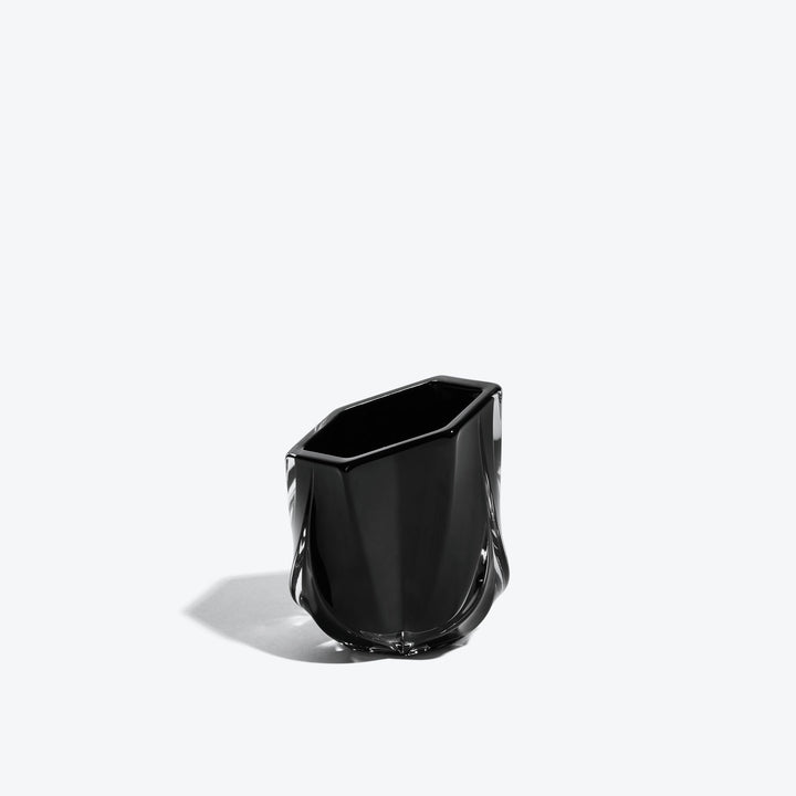 Shimmer Tealight Holder — Black faceted glass holder, three-quarter side view on white
