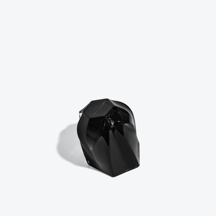 Shimmer Tealight Holder — Black holder tipped on its side, showing the twisted faceted base
