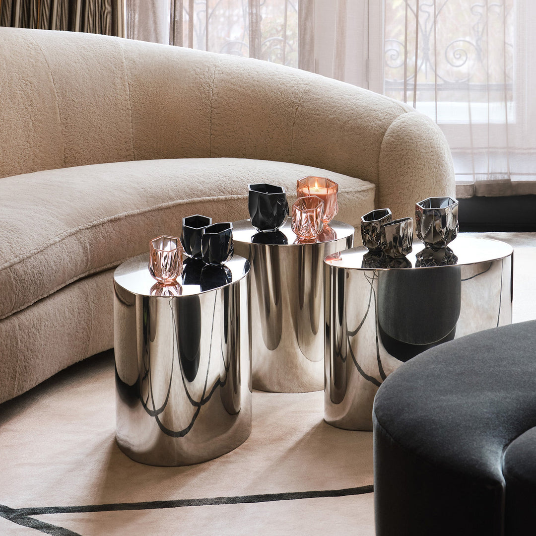 Shimmer Tealight Holder — black, rose and metallic holders grouped on mirrored side tables beside a curved sofa