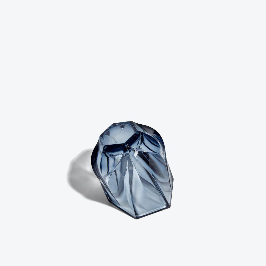Shimmer Tealight Holder — Slate Blue holder tipped on its side, showing the twisted faceted base