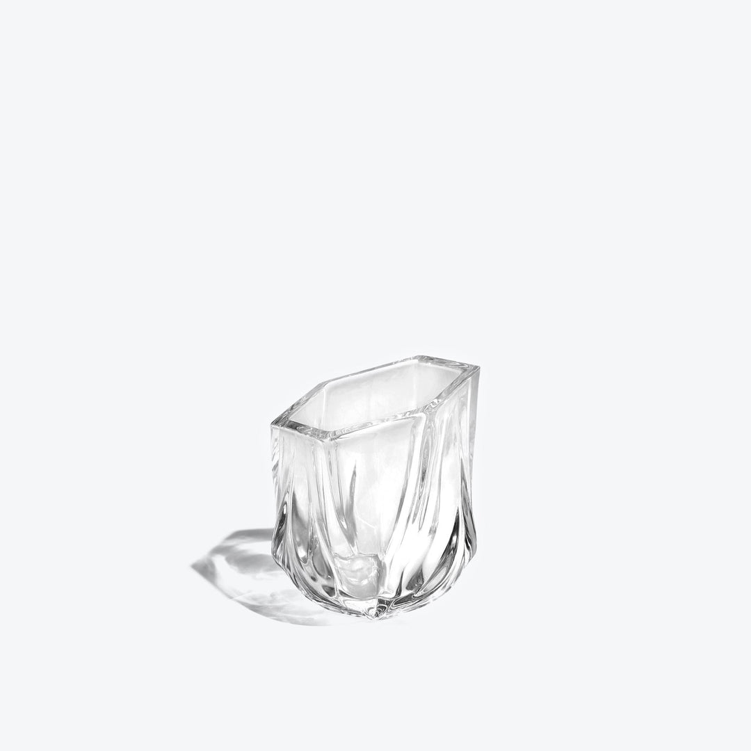 Shimmer Tealight Holder — Clear faceted glass holder, three-quarter side view on white
