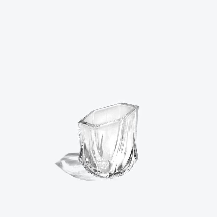 Shimmer Tealight Holder — Clear faceted glass holder, three-quarter side view on white