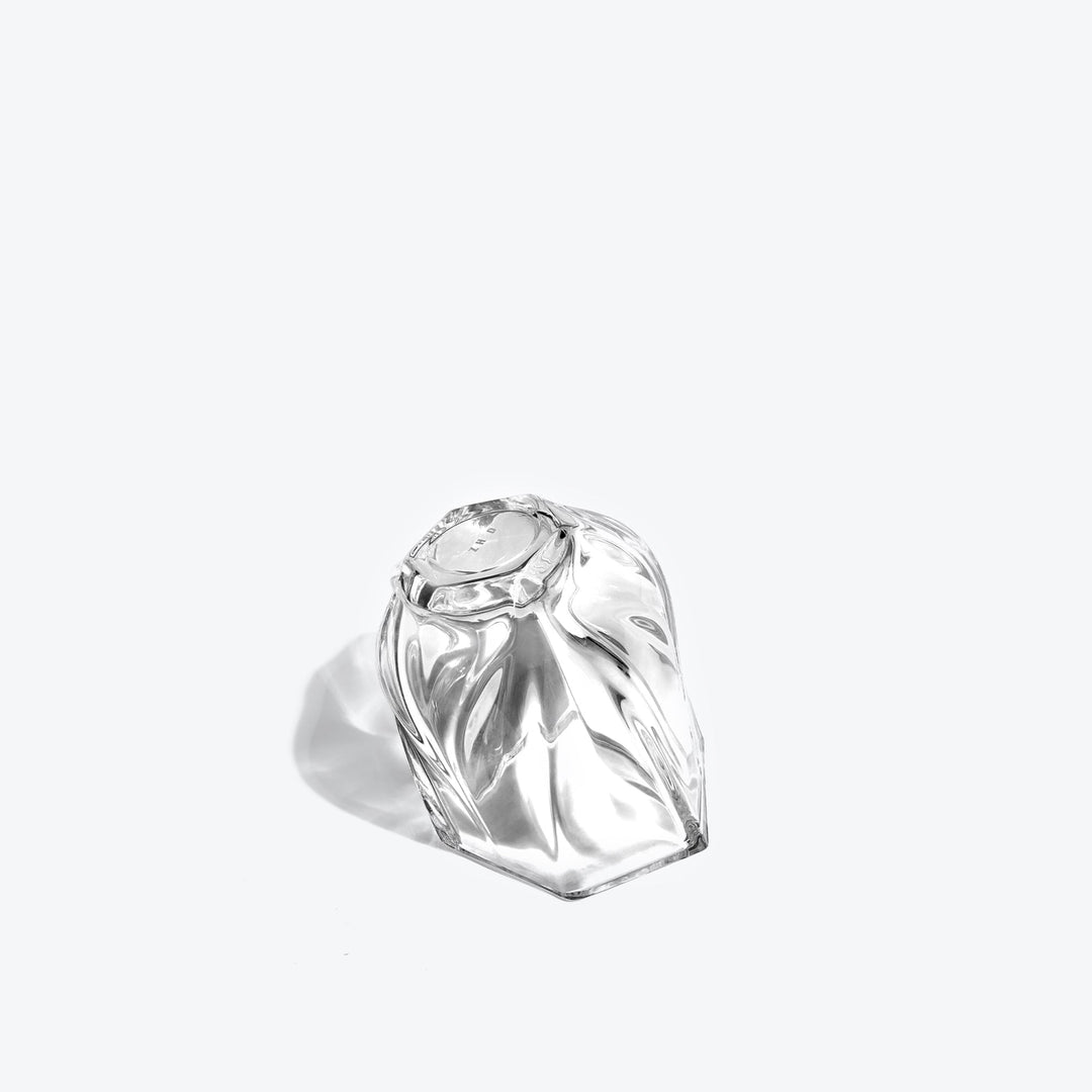Shimmer Tealight Holder — Clear holder tipped on its side, showing the twisted faceted base