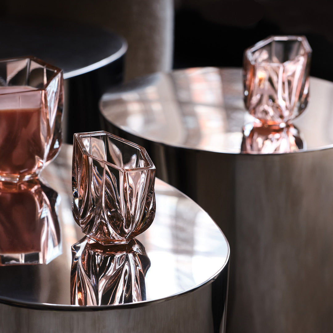 Shimmer Tealight Holder — Rose holders reflected on polished steel side tables, close-up