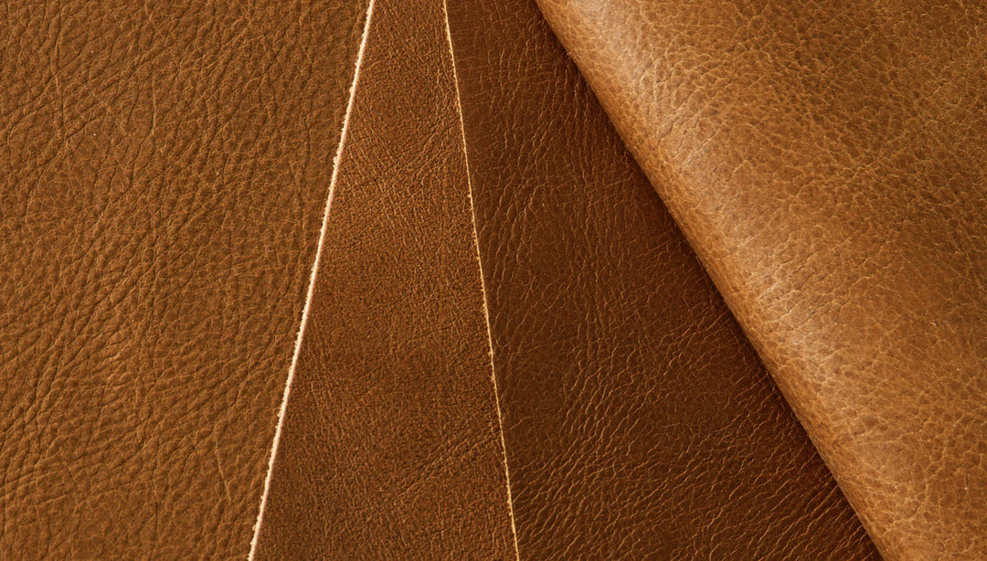 Rich brown leather upholstery with precise stitching, showcasing premium material texture.
